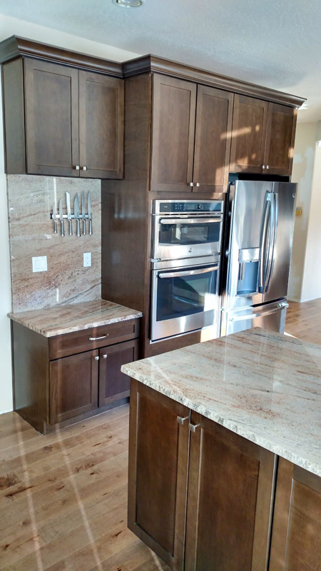 Dark cabinet kitchen with double wall oven in Coeur d'Alene, Idaho