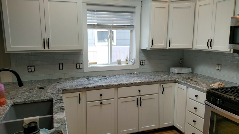 White shaker kitchen with subway tile in Post Falls, Idaho