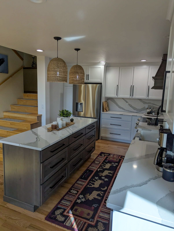 Quartz island kitchen with pendant lighting in Hayden, Idaho