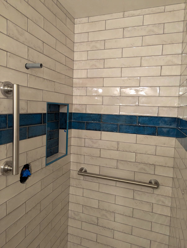 White and blue subway tile shower remodel in Coeur d'Alene, Idaho