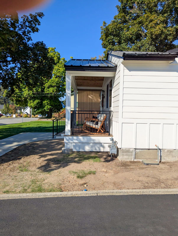 Exterior porch addition with new railing in Post Falls, Idaho