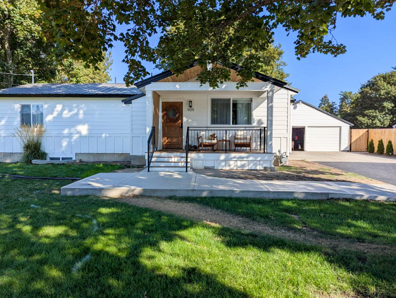 White cottage remodel with covered porch in Coeur d'Alene, Idaho