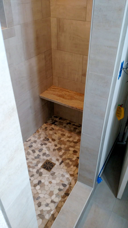 Pebble-floor walk-in shower in Dalton Gardens, Idaho